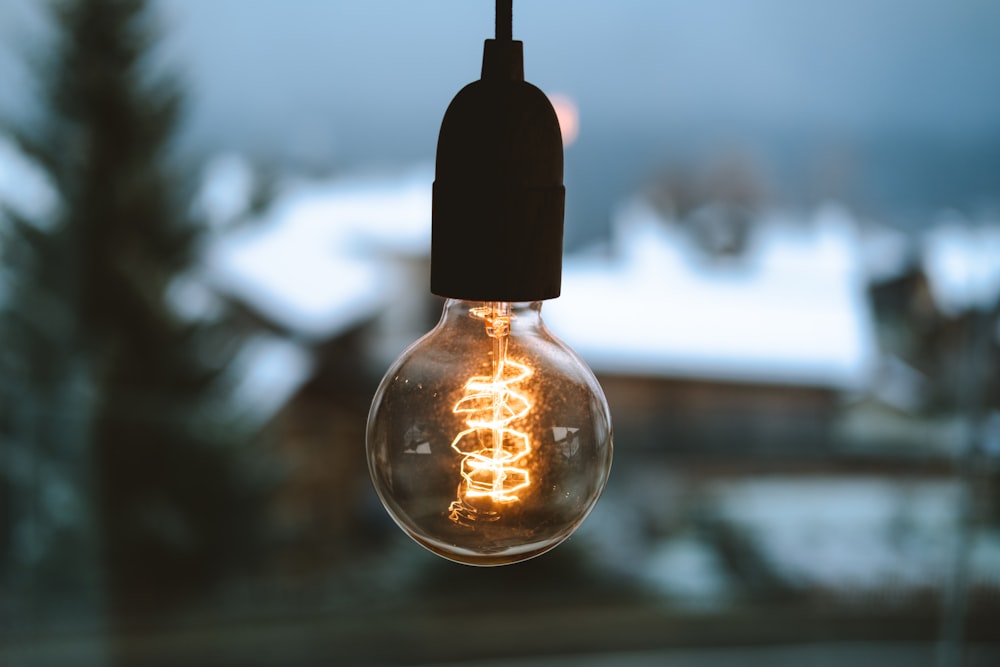 selective focus photography of light bulb