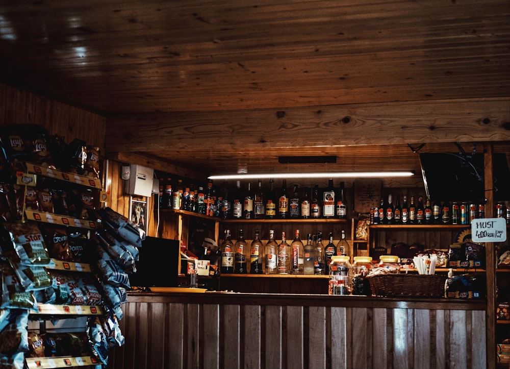 brown wooden bar counter with bottles