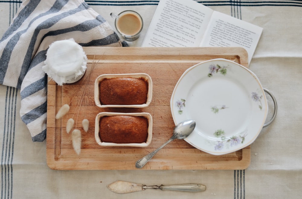 stainless steel spoon on white ceramic plate