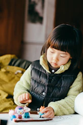 girl in black bubble jacket smiling