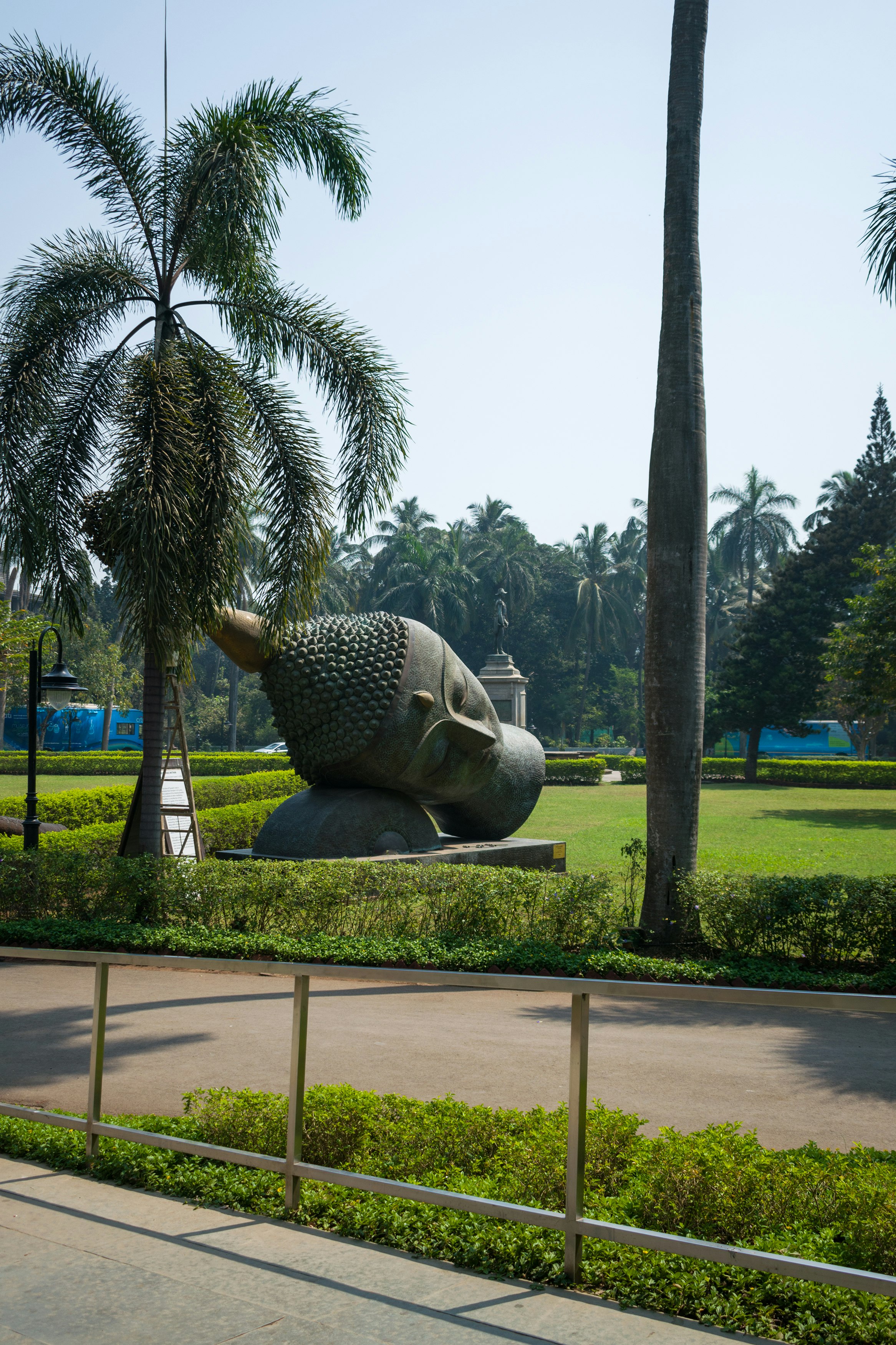 grey elephant statue on green grass field during daytime