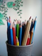 coloring pencils in gray container
