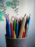 coloring pencils in gray container