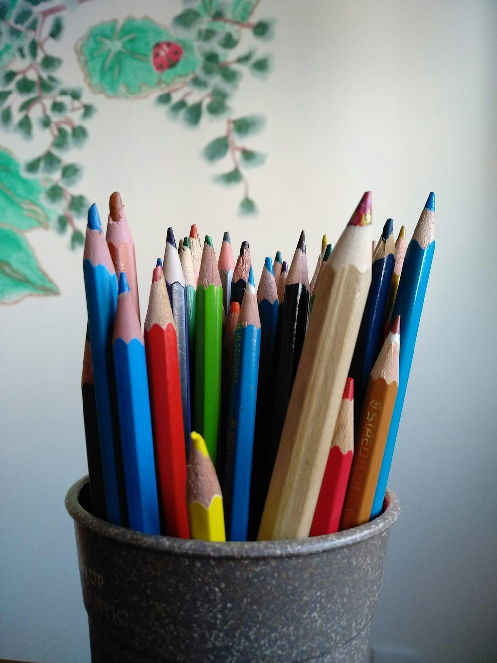 coloring pencils in gray container