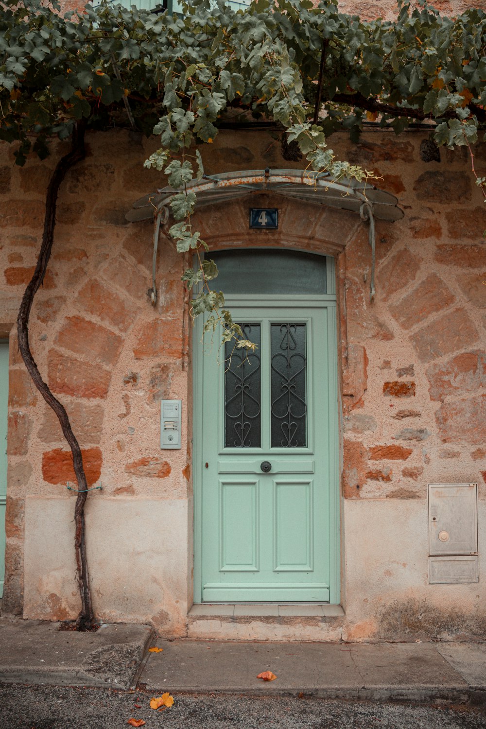 white wooden door with brown brick wall