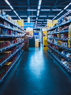 yellow and green labeled box on shelves