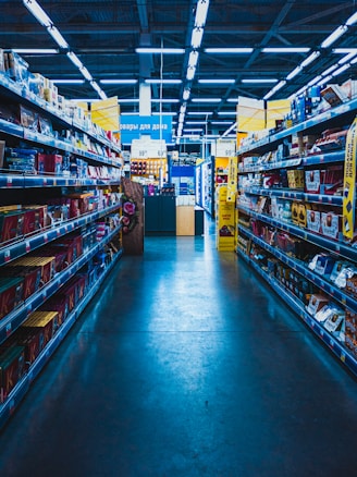 yellow and green labeled box on shelves