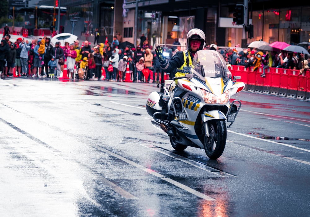 people riding sports bike on road during daytime