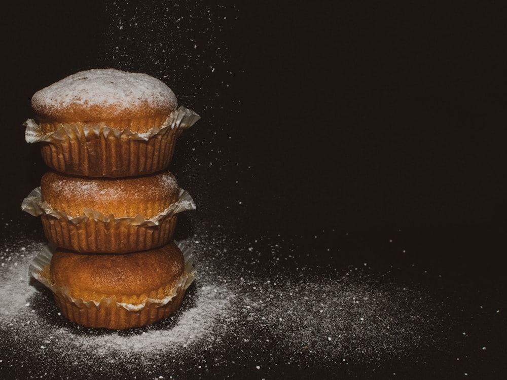 brown cupcake on black table