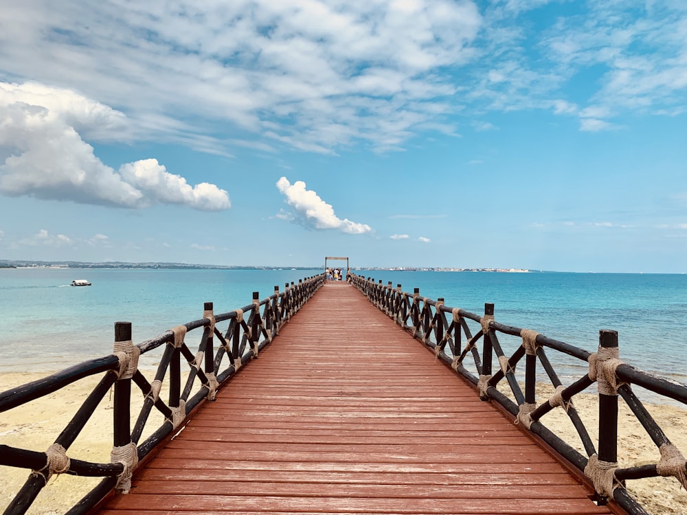 brown wooden dock under blue sky during daytime