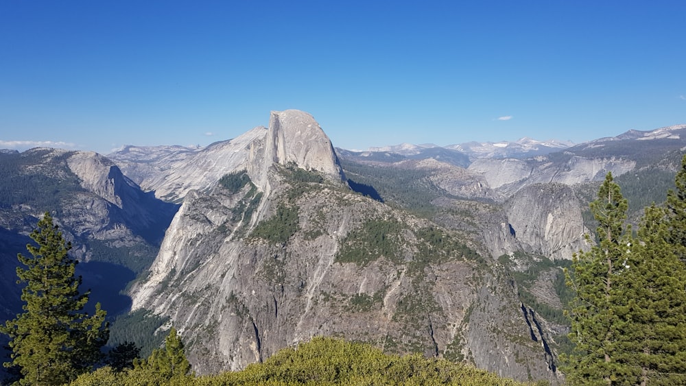 green and gray mountain under blue sky during daytime