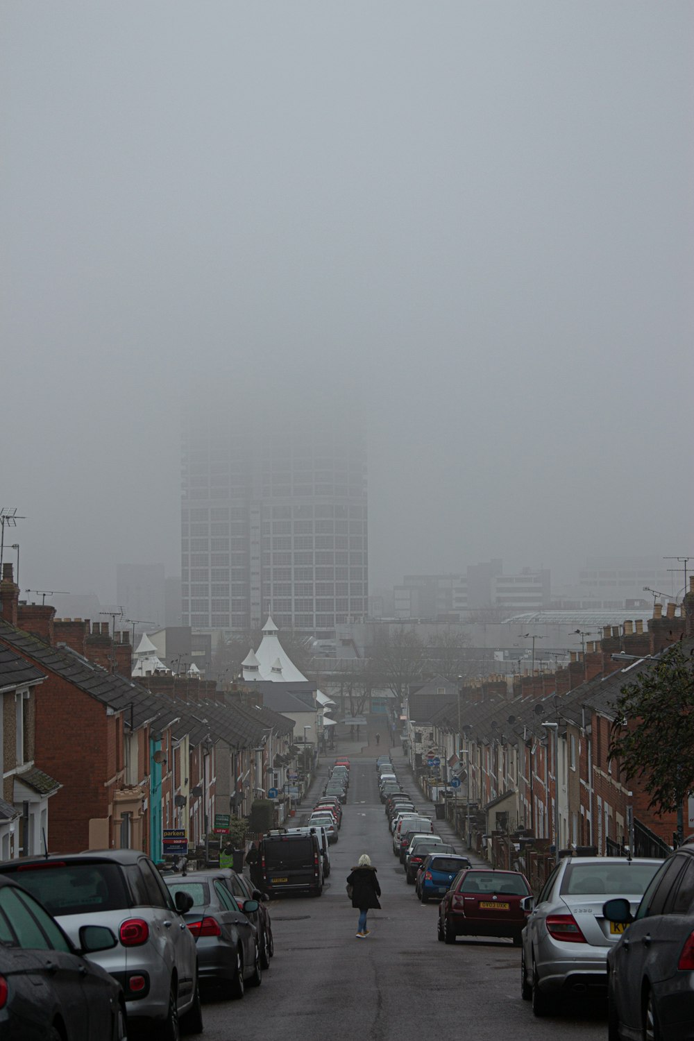 cars parked on street near buildings during daytime