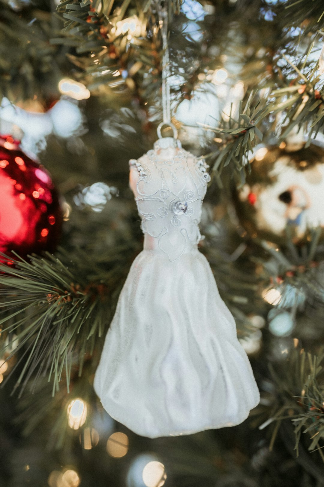 white angel figurine on christmas tree