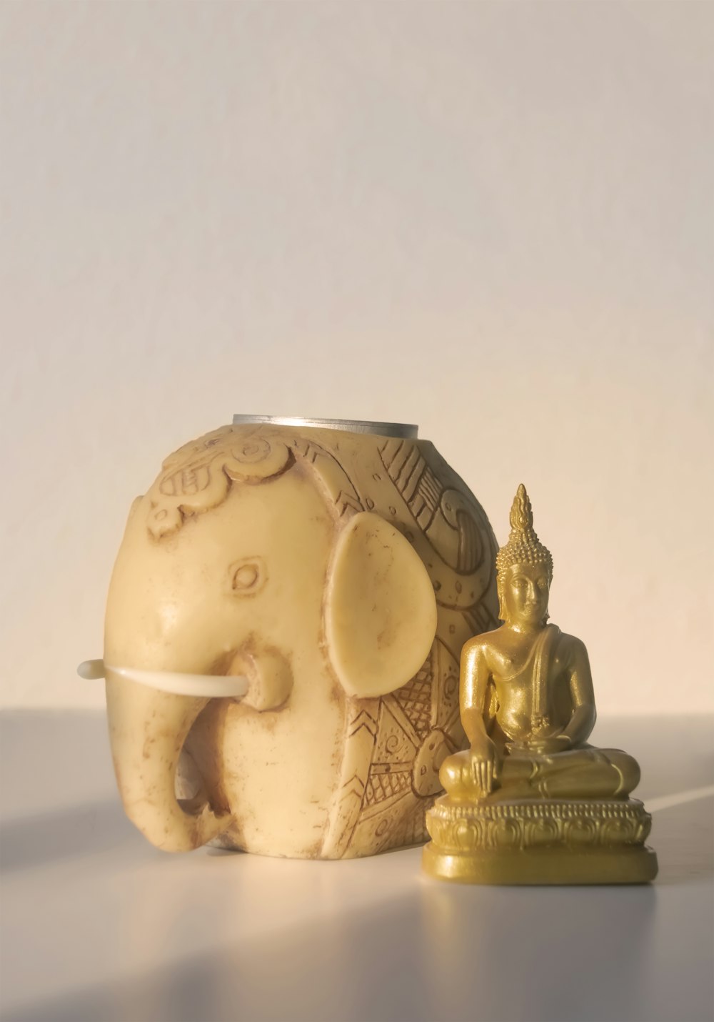 gold and white ceramic figurine