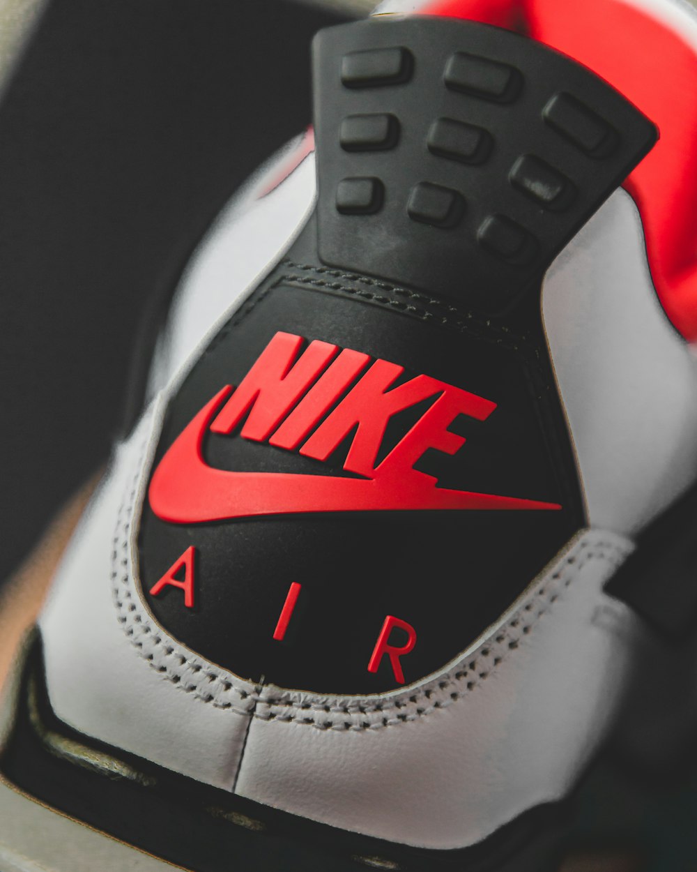 white black and red nike shoe