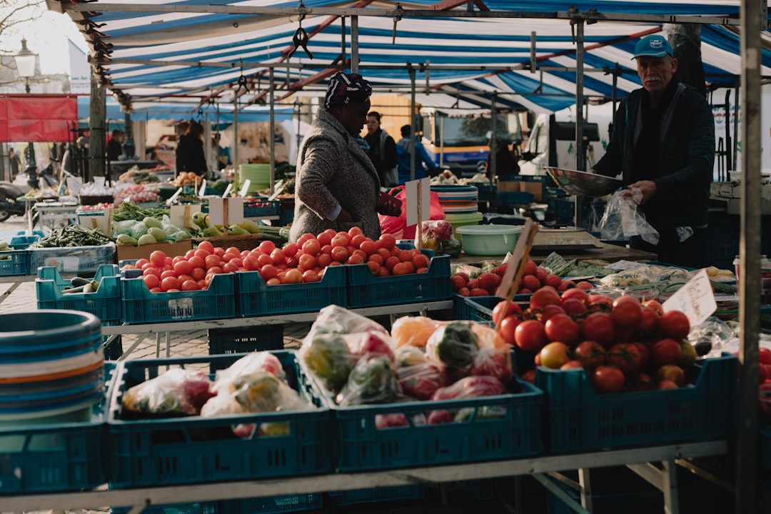 red and white fruit display on market