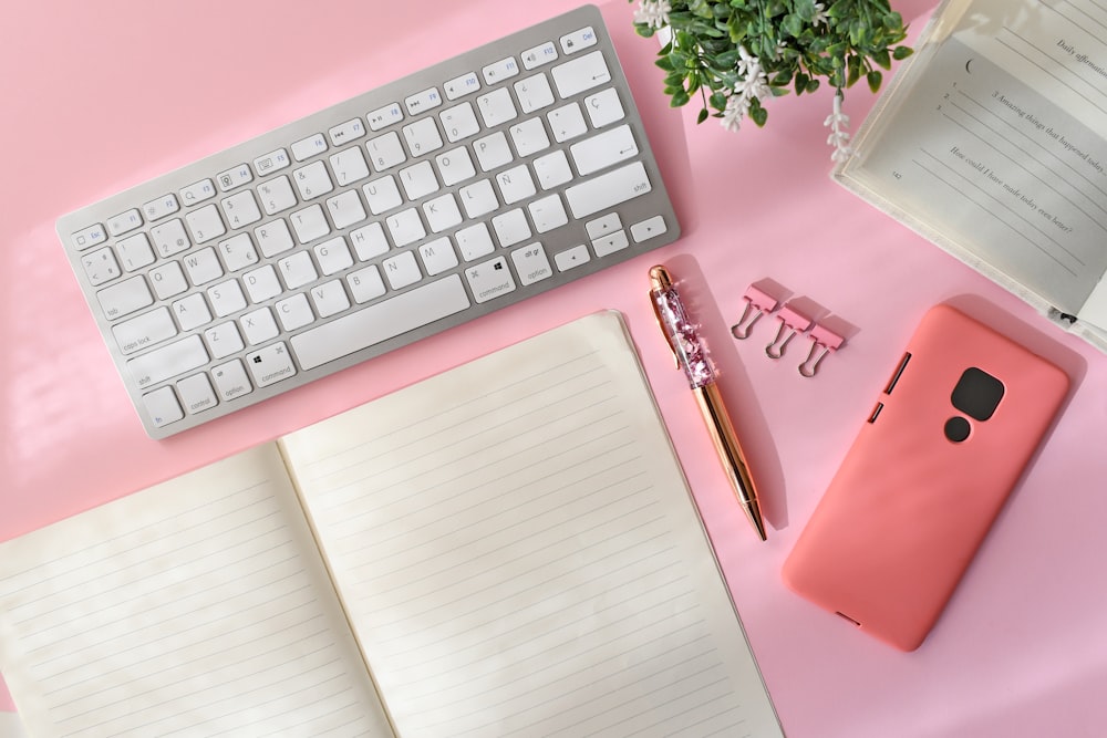 silver apple keyboard on white table