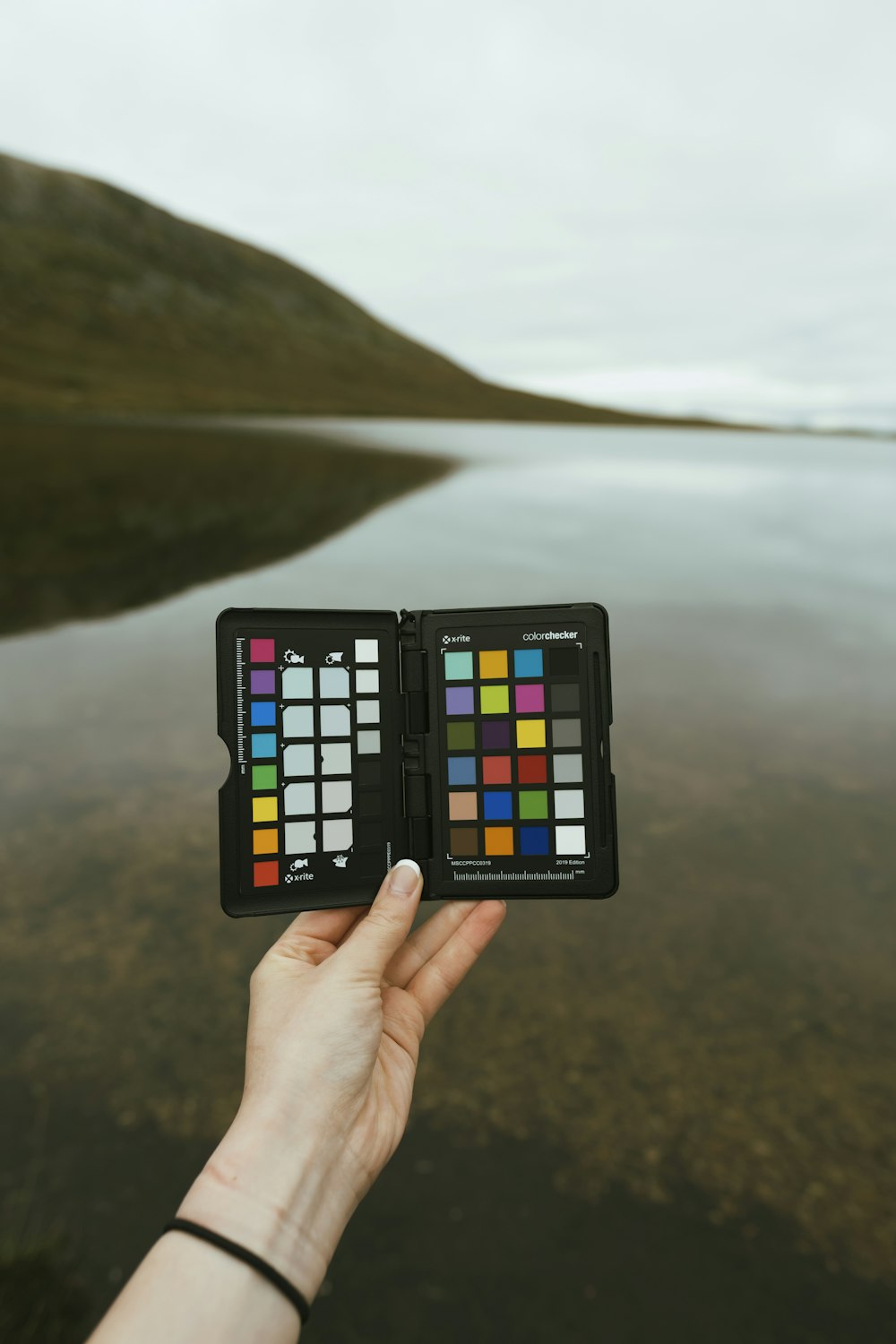 person holding 3 x 3 rubiks cube