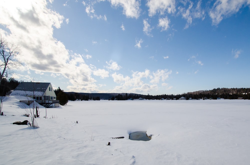 white snow covered field under blue sky during daytime