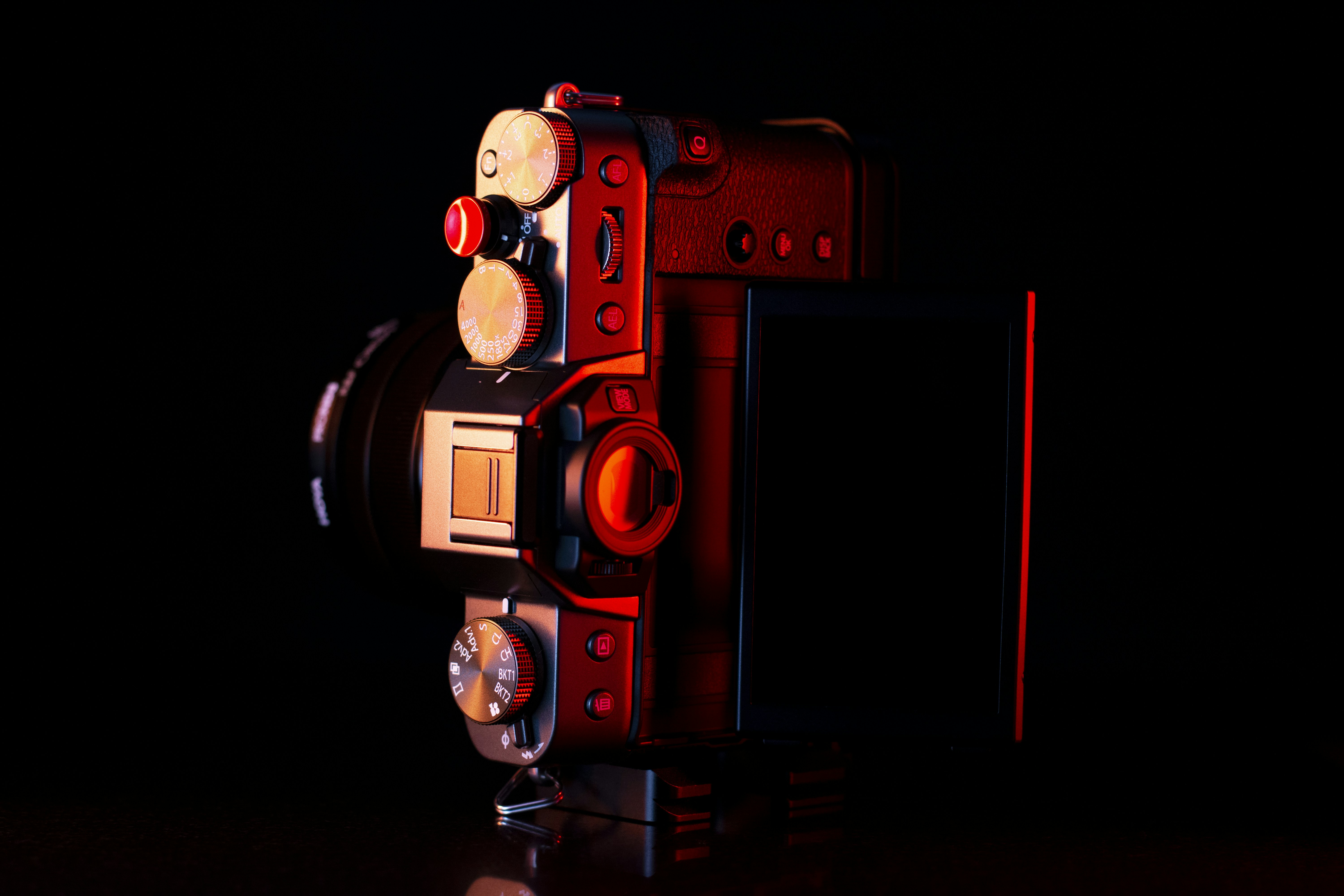 Professional digital camera sitting on a flat surface.