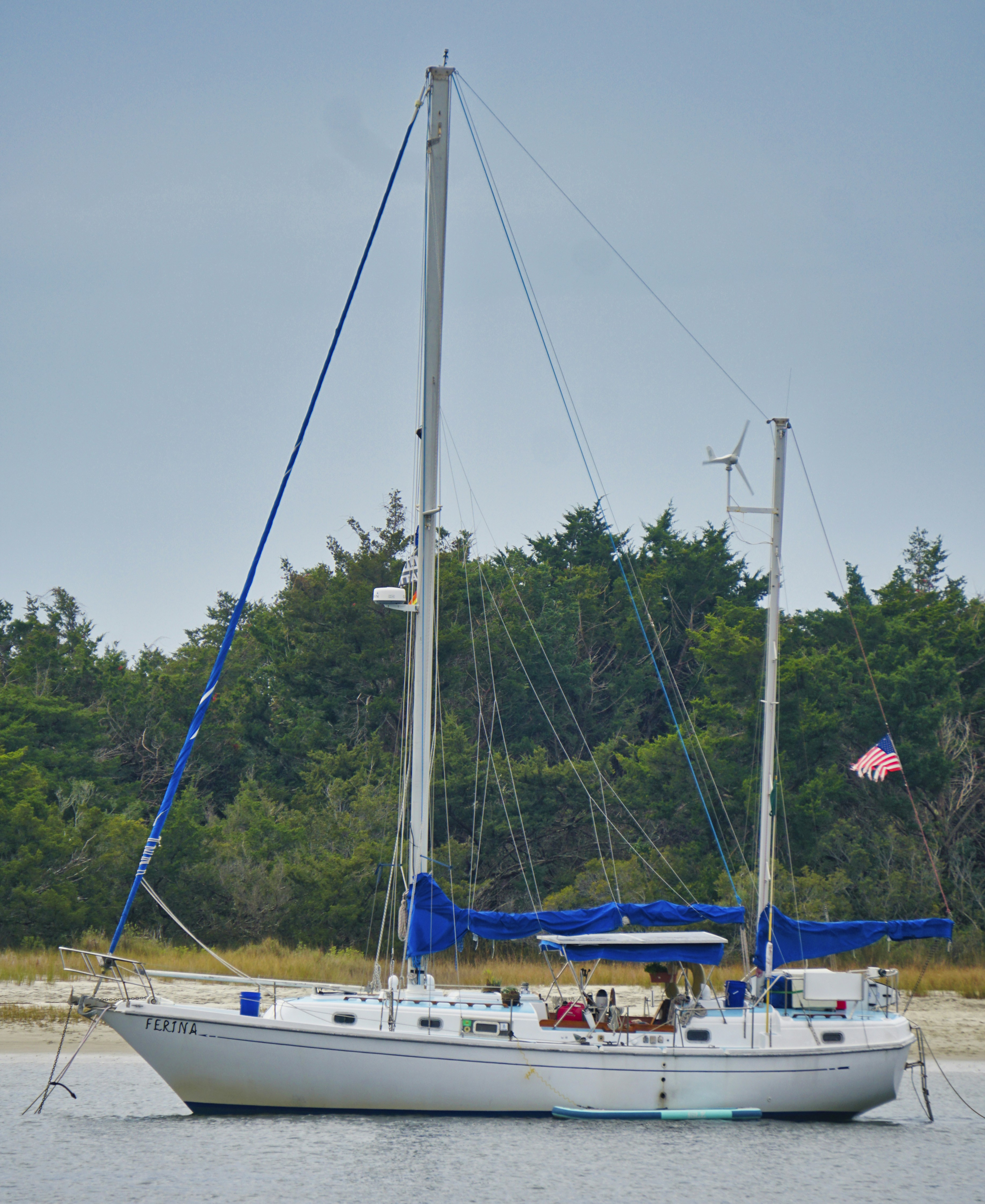 white sail boat on sea during daytime