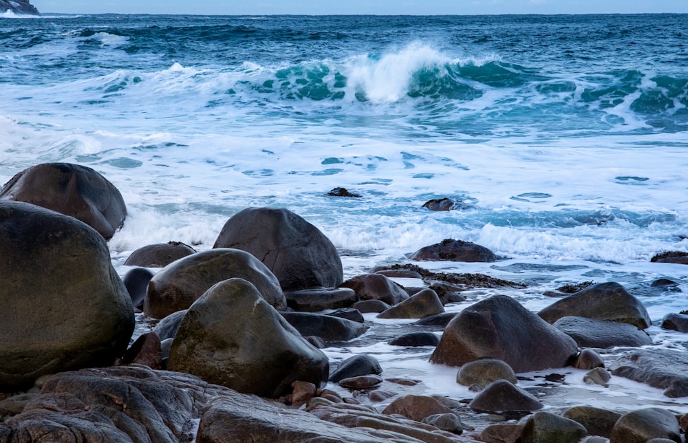 rocky shore with sea waves crashing on rocks