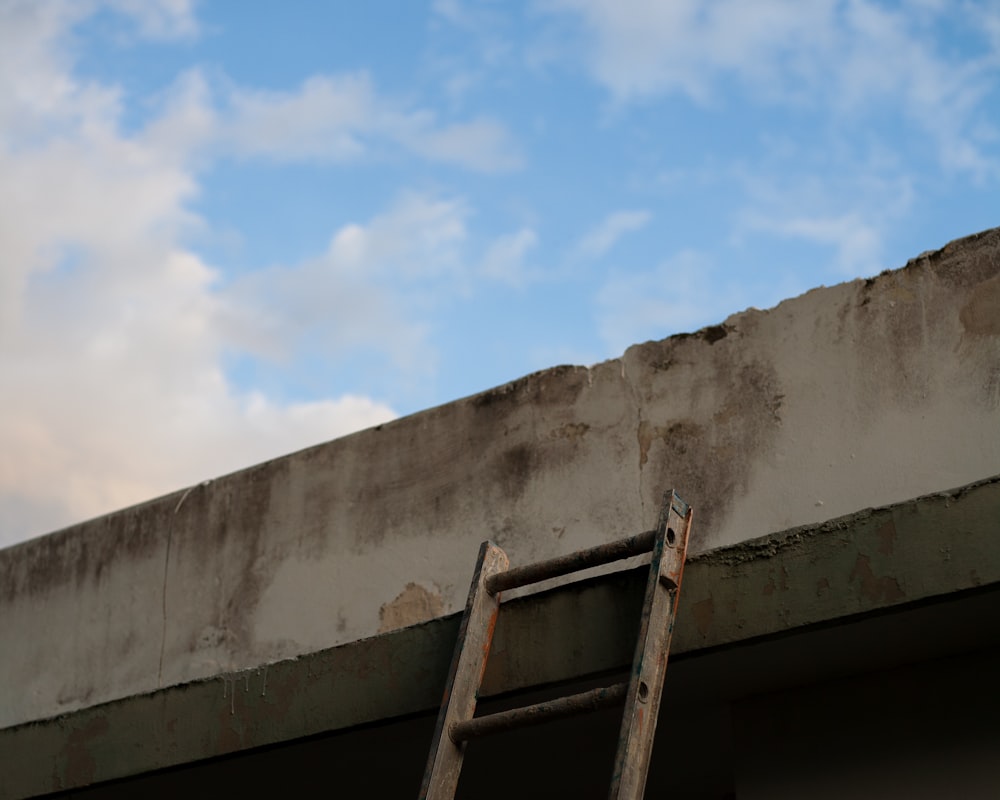 white concrete wall under blue sky during daytime