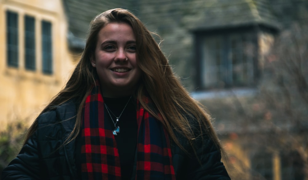 woman in black jacket smiling