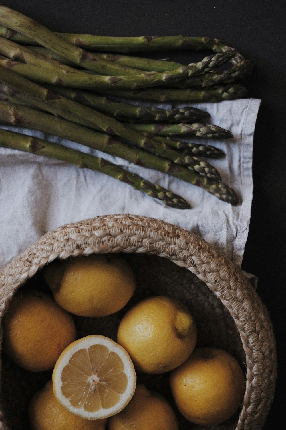 orange fruits on brown woven basket