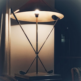 Minimalist desk lamp with geometric shapes on a clean surface