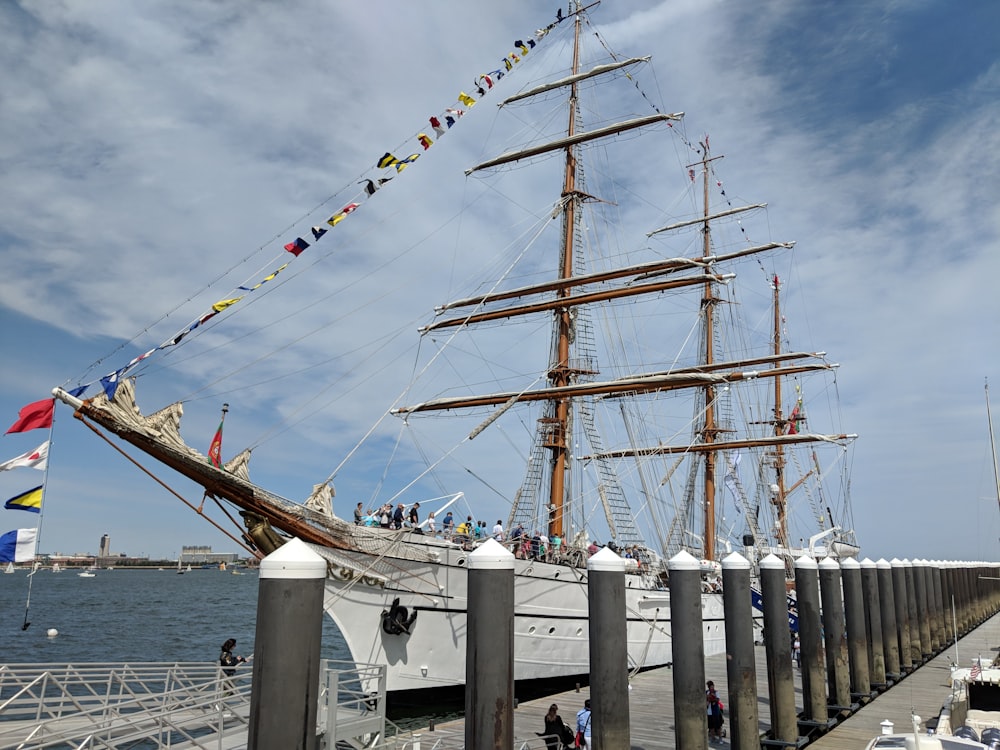 white and brown ship on sea during daytime