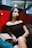 woman in black tube dress sitting on gray couch