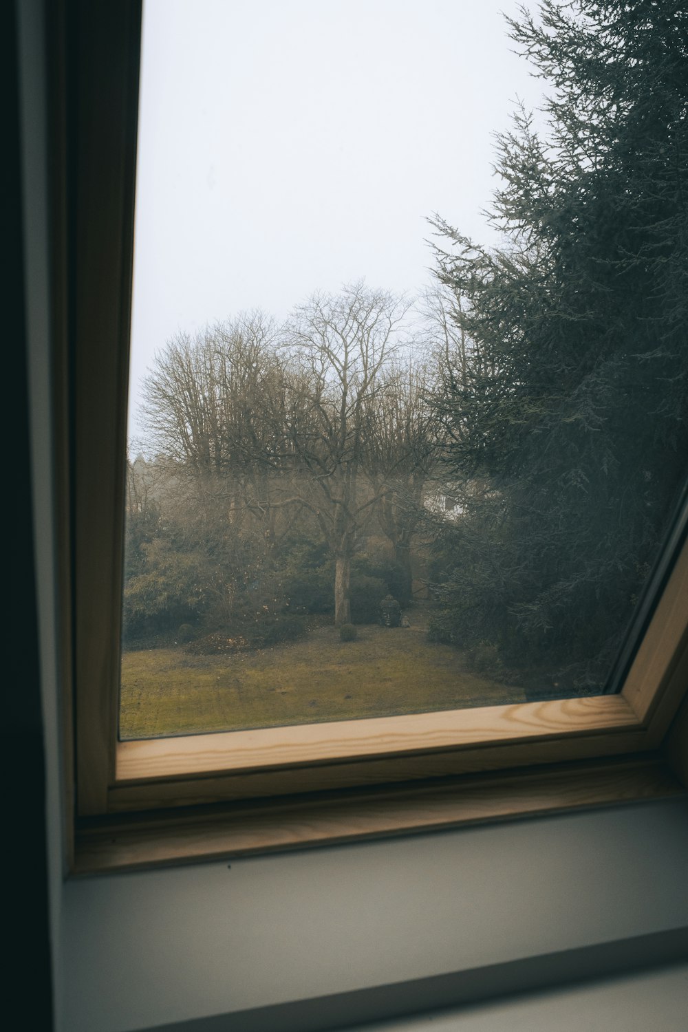 brown wooden framed glass window