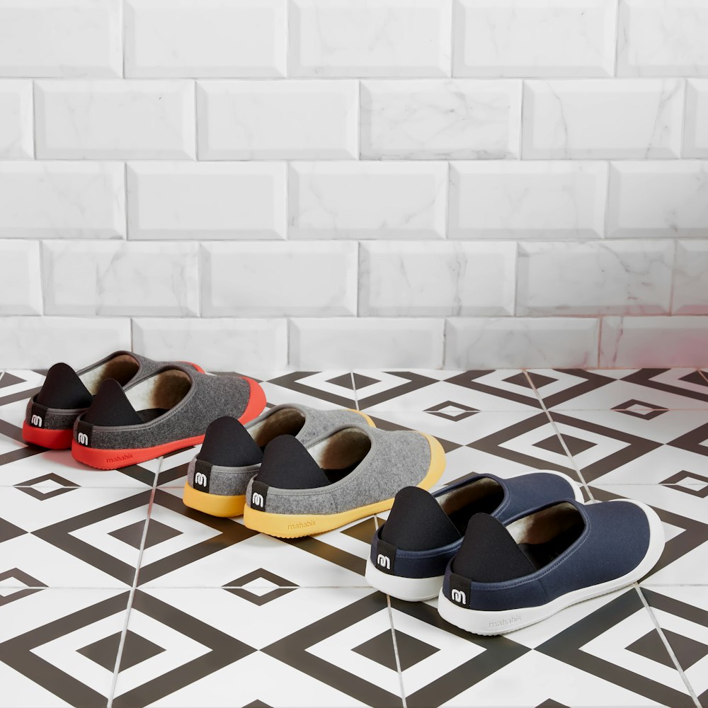 brown and black flip flops on white and blue checkered floor