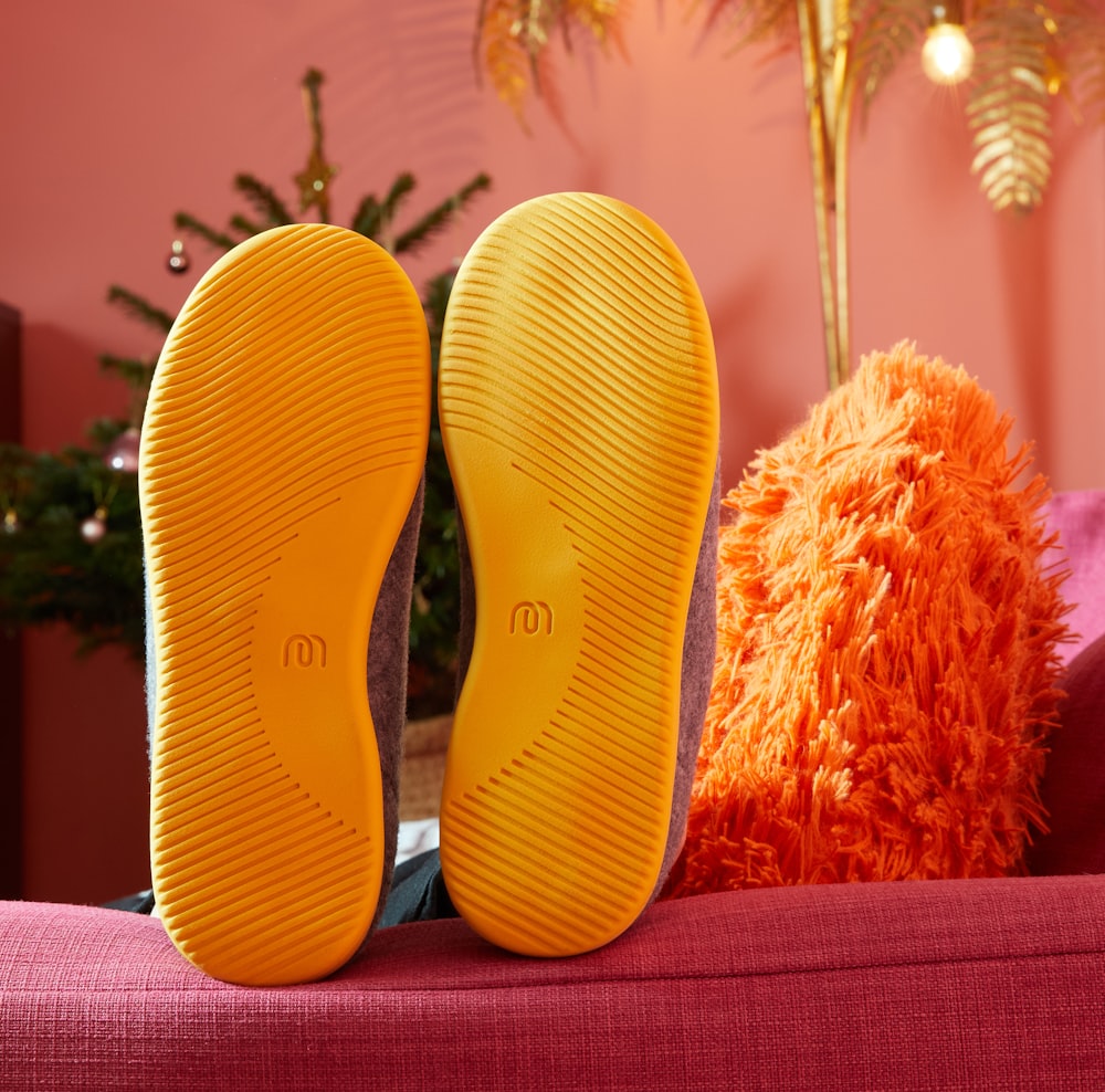 yellow and red slide sandals