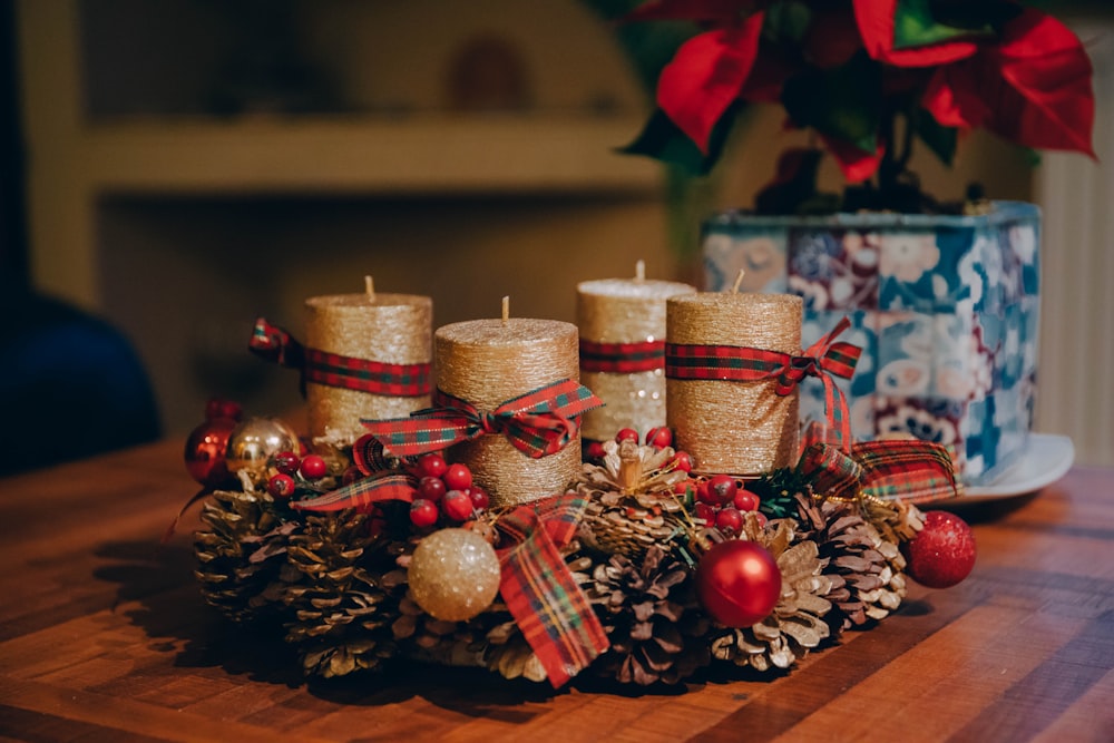 a group of candles sitting on top of a wooden table