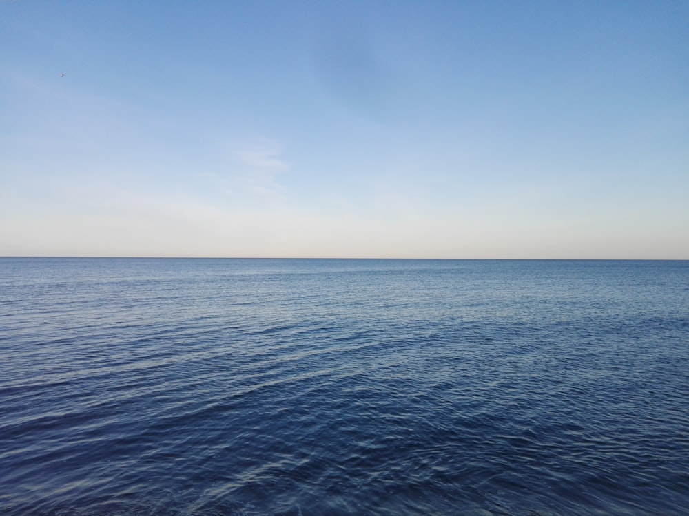 blue sea under blue sky during daytime