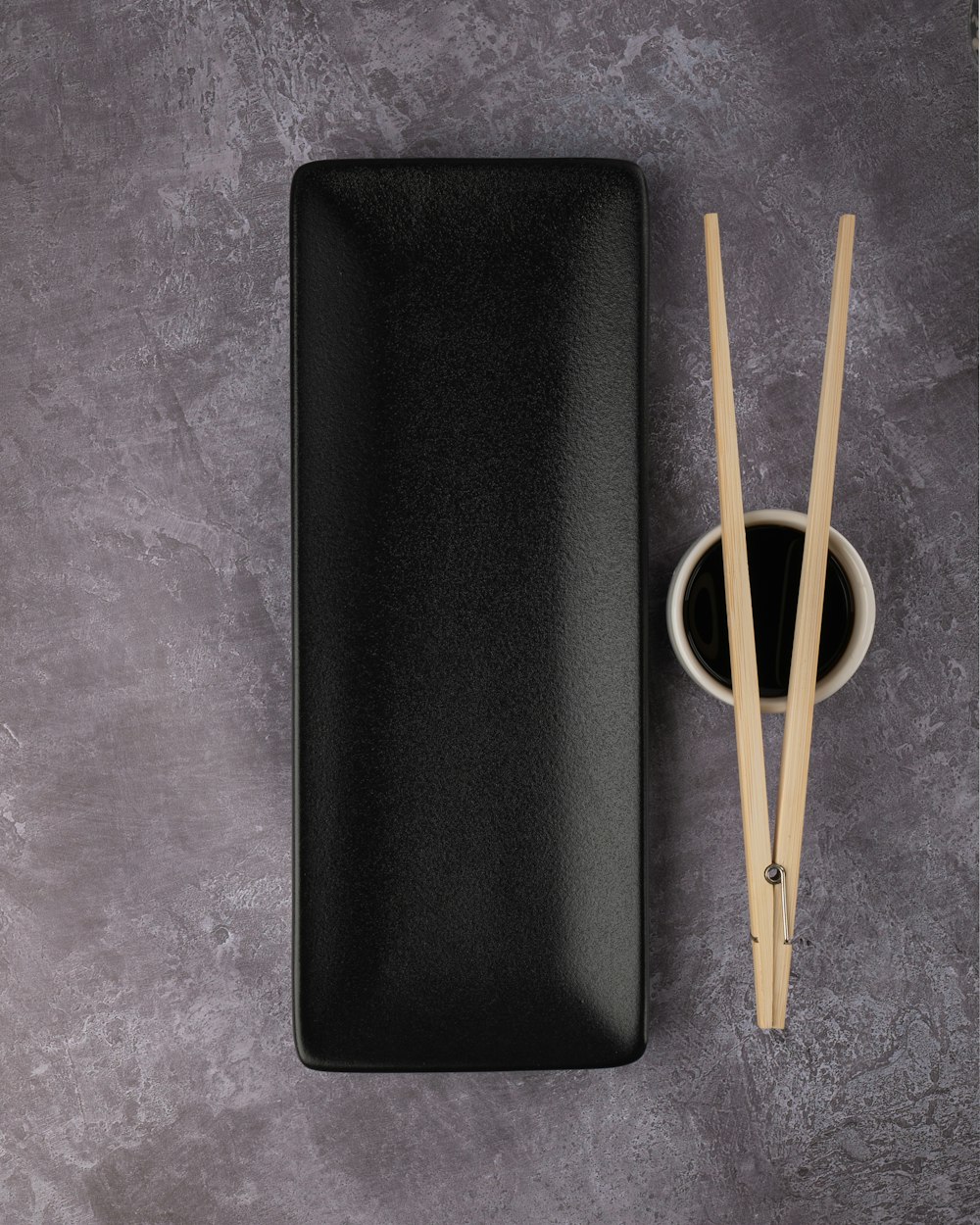 yellow plastic spoon on black leather case