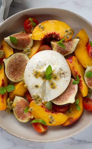 sliced fruits on white ceramic plate