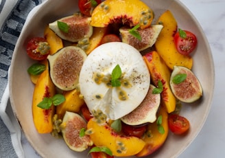 sliced fruits on white ceramic plate