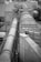 A complex industrial structure featuring large cylindrical pipes and ducts connected to various platforms and support structures. The environment suggests a manufacturing or processing plant, with metallic surfaces and geometric patterns visible.