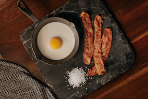 white egg on black plate