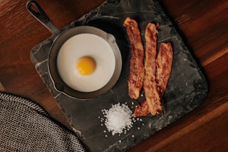 white egg on black plate