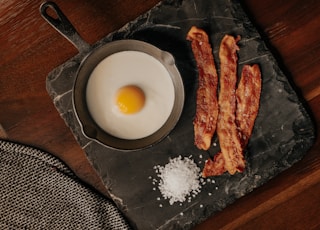 white egg on black plate