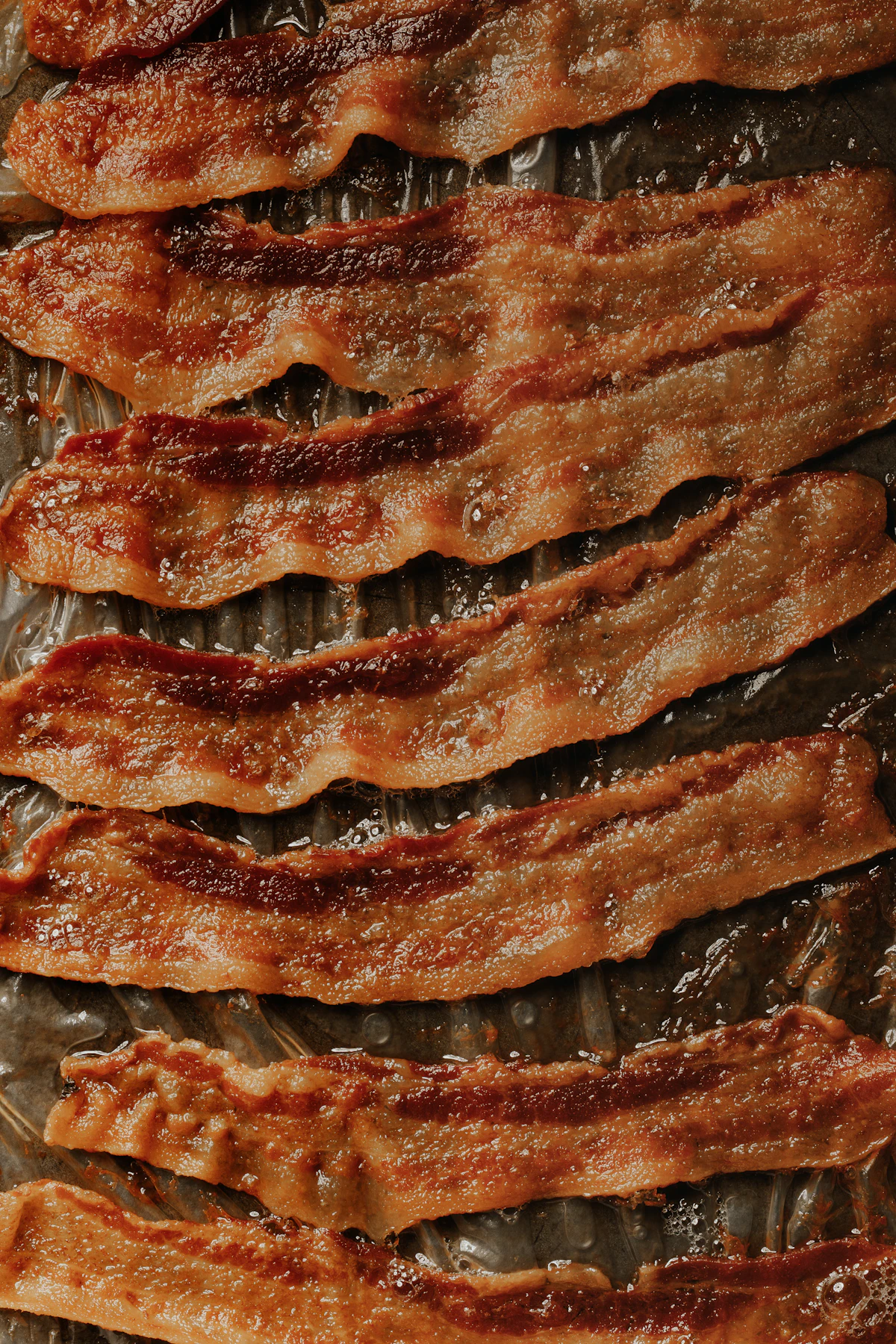 A breakfast plate with bacon and eggs
