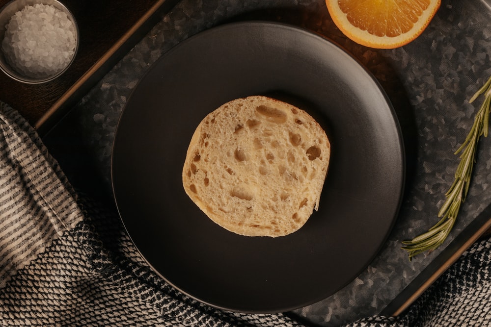 brown bread on black round plate