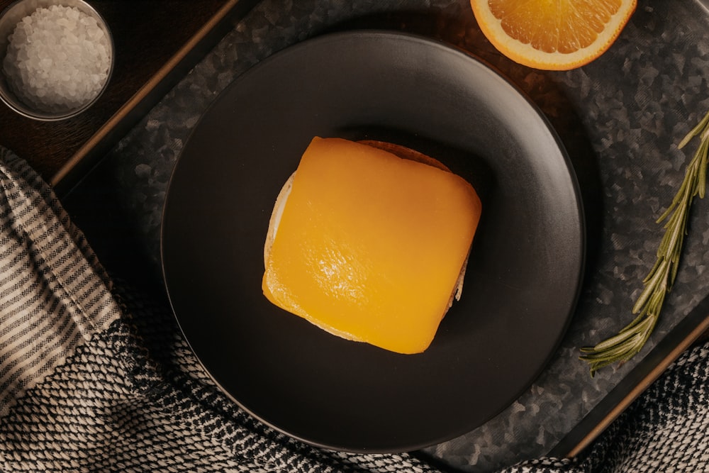 yellow fruit on black round bowl