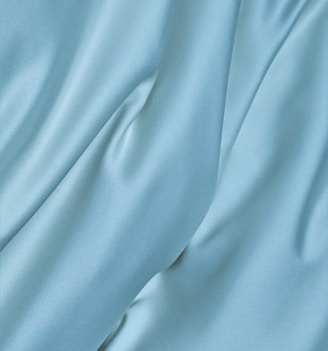 blue textile in close up photography