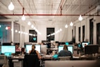 people sitting on chair in front of computer