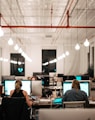 people sitting on chair in front of computer